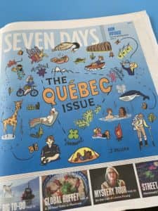 Photo of newspaper with Quebec illustration on cover