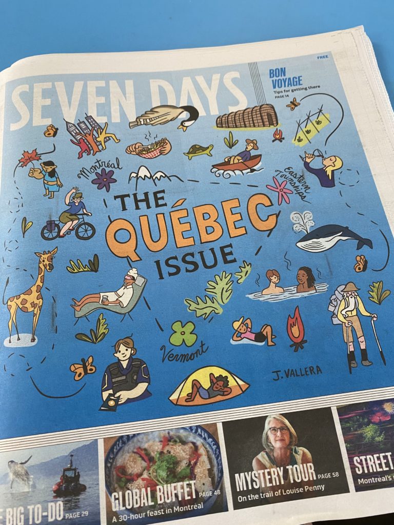 Photo of newspaper with Quebec illustration on cover